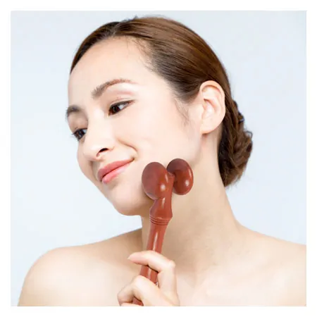 Wellness massage roller made of wood